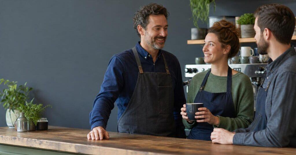 Limerick cafe owner and staff discussing auto-enrolment pensions